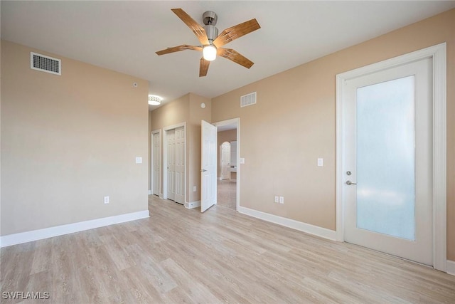 unfurnished room with ceiling fan and light hardwood / wood-style floors