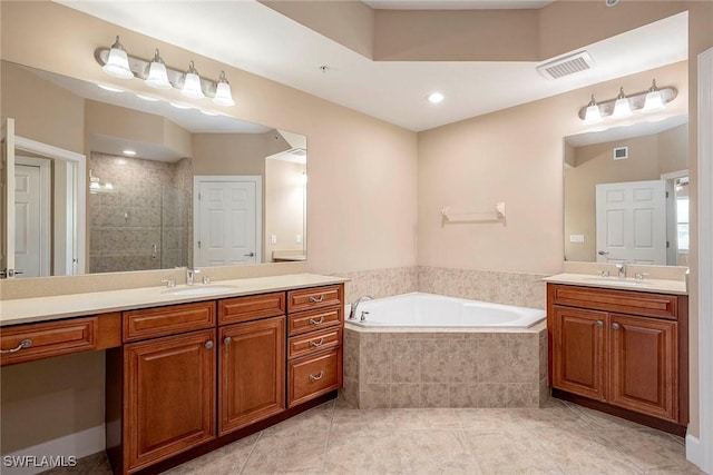 bathroom featuring tile patterned floors, vanity, and separate shower and tub