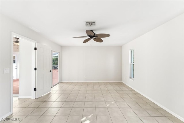 spare room featuring ceiling fan and light tile patterned floors