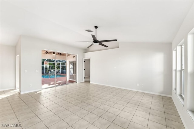 tiled spare room with ceiling fan and lofted ceiling