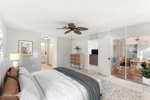 tiled bedroom with ensuite bathroom and ceiling fan