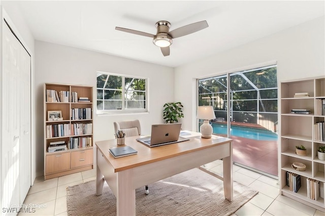 office with ceiling fan and light tile patterned floors