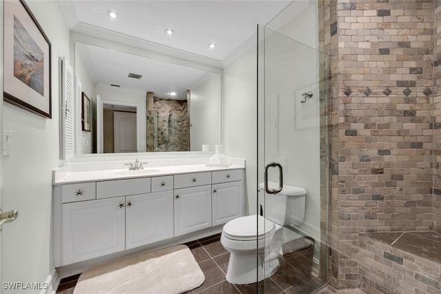 bathroom featuring ornamental molding, vanity, tile patterned flooring, toilet, and a shower with shower door