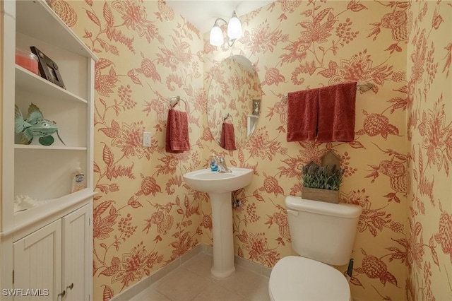 bathroom with tile patterned floors and toilet