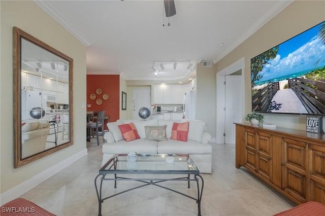 tiled living room featuring crown molding and ceiling fan