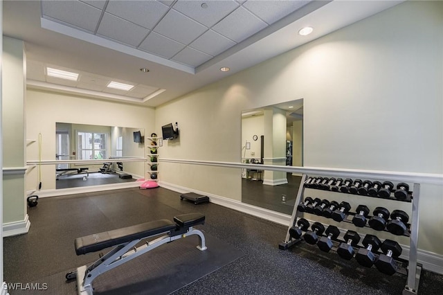 workout room featuring a paneled ceiling