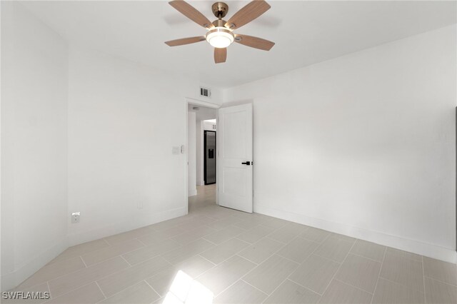 unfurnished room with ceiling fan