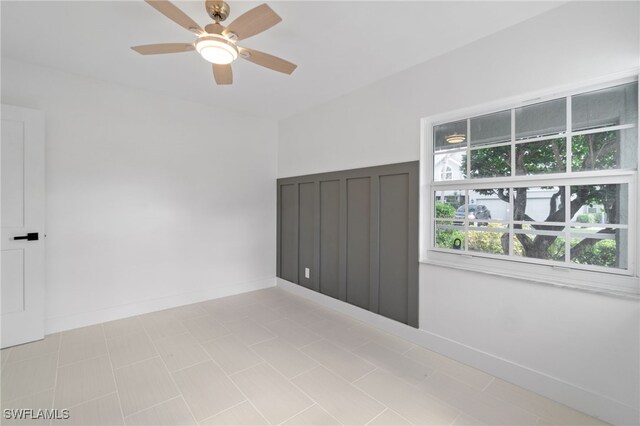 empty room featuring ceiling fan