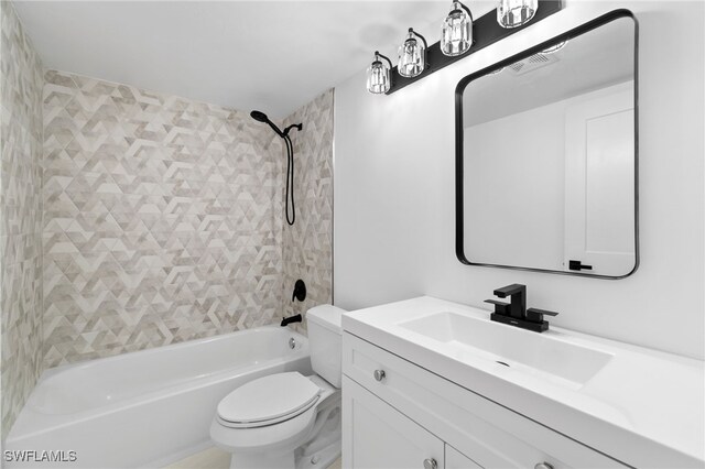 full bathroom with toilet, vanity, and shower / bathtub combination