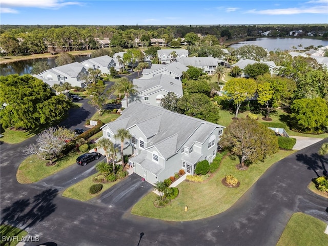 drone / aerial view with a water view