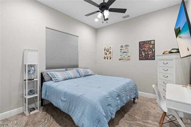 bedroom with a ceiling fan, visible vents, and baseboards