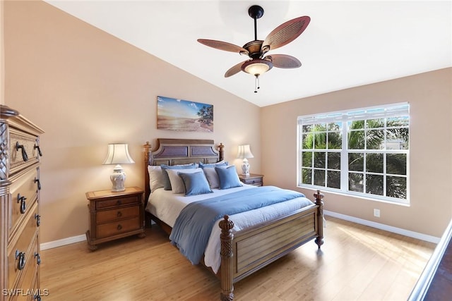 bedroom featuring lofted ceiling, light hardwood / wood-style floors, and ceiling fan