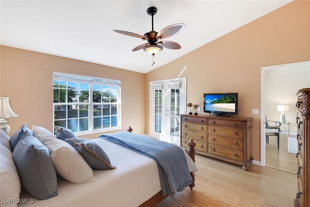 bedroom featuring french doors, lofted ceiling, access to outside, ceiling fan, and light hardwood / wood-style floors