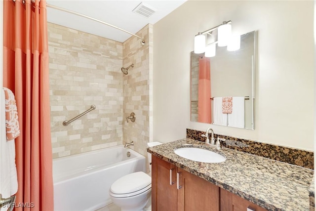 full bathroom with vanity, toilet, and shower / bath combo with shower curtain