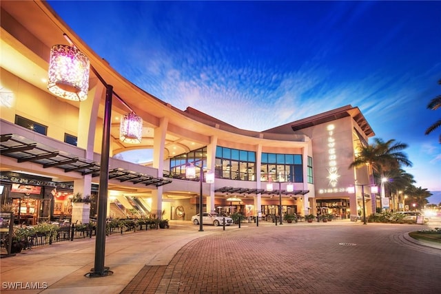 view of outdoor building at dusk