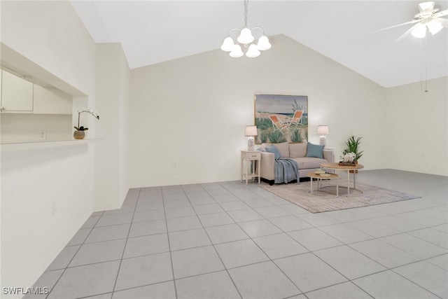 sitting room featuring lofted ceiling, light tile patterned floors, and ceiling fan with notable chandelier