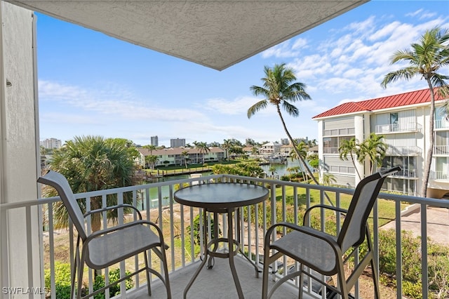 balcony featuring a water view