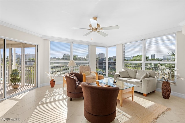 sunroom / solarium featuring ceiling fan and a healthy amount of sunlight