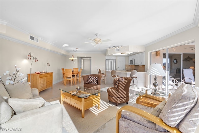 living room featuring ceiling fan and crown molding