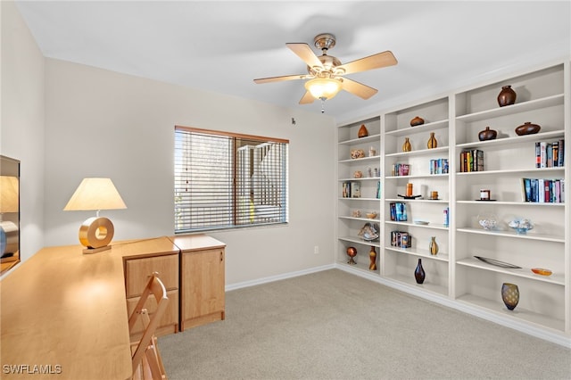 interior space with ceiling fan and light colored carpet