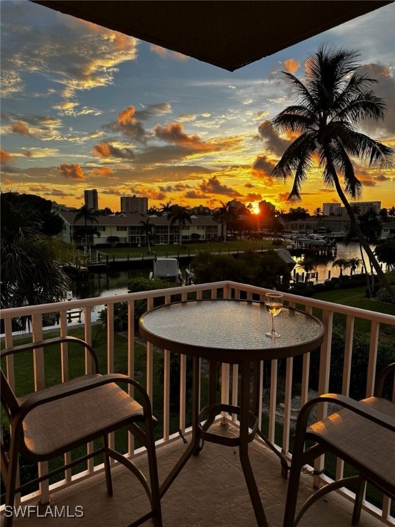 balcony at dusk with a water view