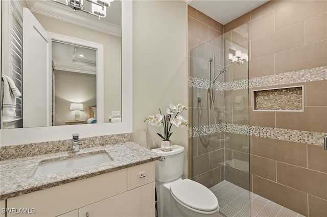 bathroom featuring vanity, toilet, a shower with door, and ornamental molding