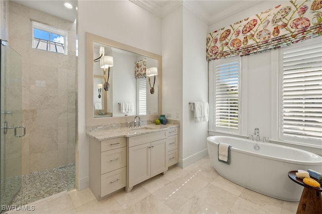 bathroom featuring crown molding, plenty of natural light, vanity, and shower with separate bathtub