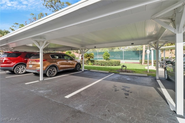 view of vehicle parking featuring a carport