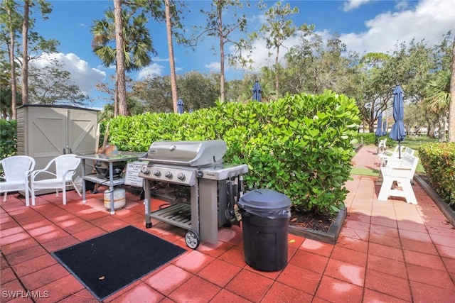 view of patio / terrace with grilling area and a storage unit