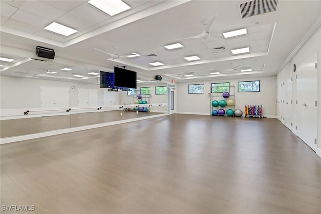 interior space featuring crown molding and wood-type flooring