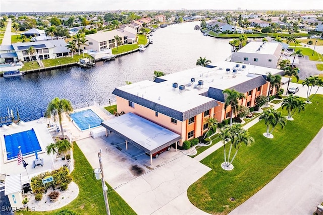 birds eye view of property featuring a water view