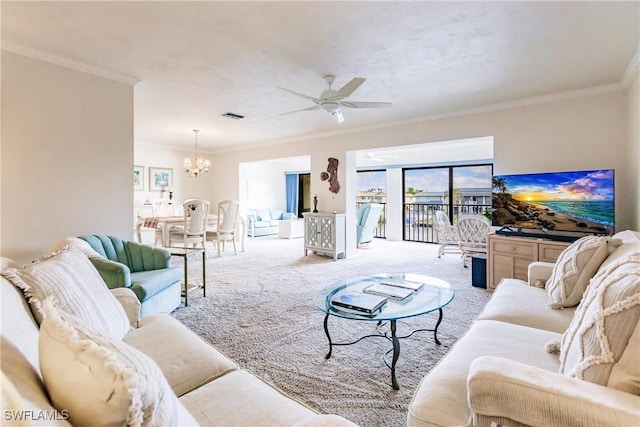 carpeted living room featuring ceiling fan with notable chandelier and ornamental molding