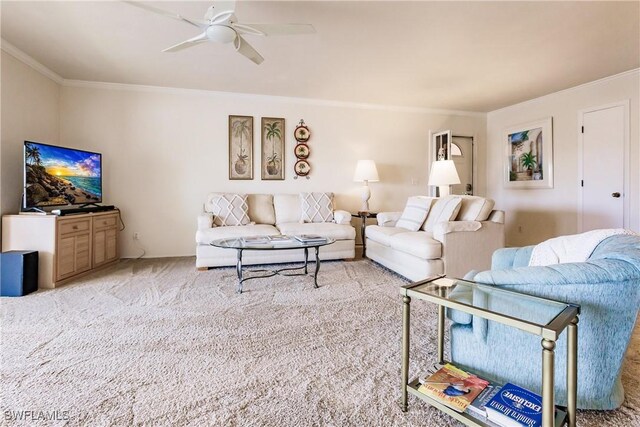 living room with light carpet, ceiling fan, and ornamental molding