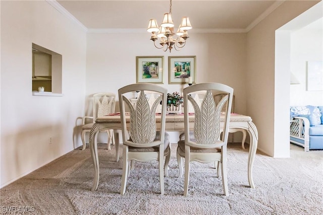 dining room with light colored carpet, ornamental molding, and an inviting chandelier