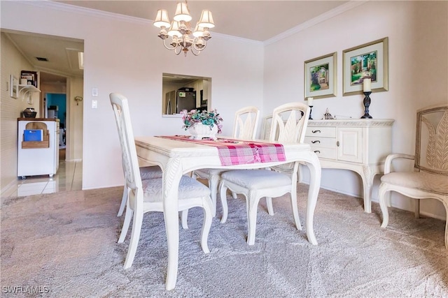 carpeted dining room featuring ornamental molding and an inviting chandelier