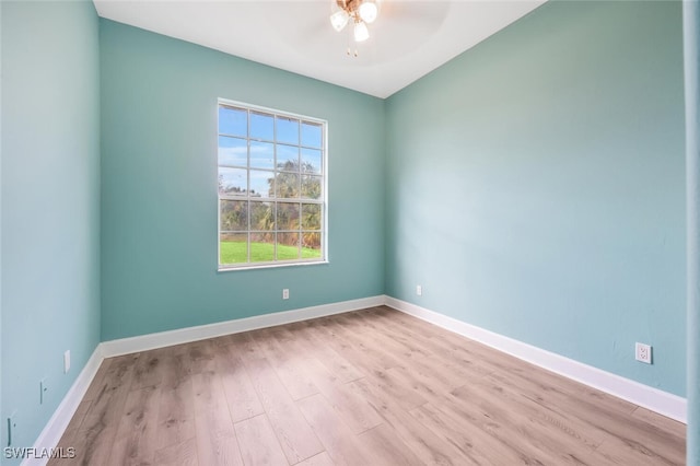 empty room with ceiling fan and light wood-type flooring