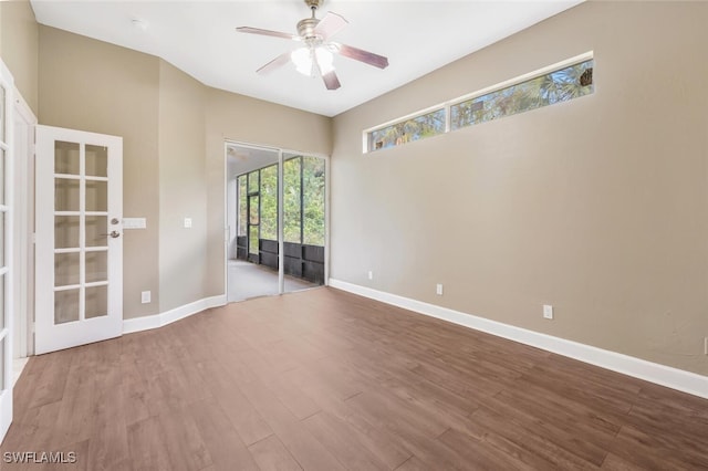 unfurnished room with ceiling fan and wood-type flooring