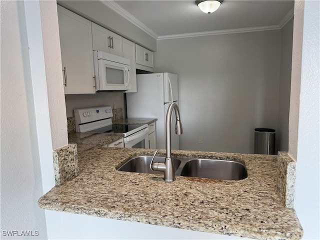 kitchen featuring white cabinetry, sink, crown molding, and white appliances