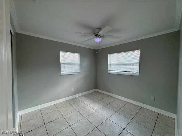 tiled spare room with ceiling fan and crown molding