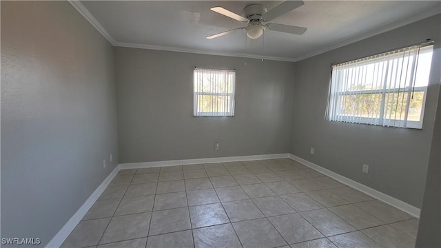 unfurnished room with light tile patterned floors, ornamental molding, ceiling fan, and a healthy amount of sunlight