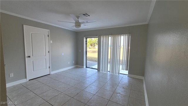 tiled empty room featuring ceiling fan and crown molding