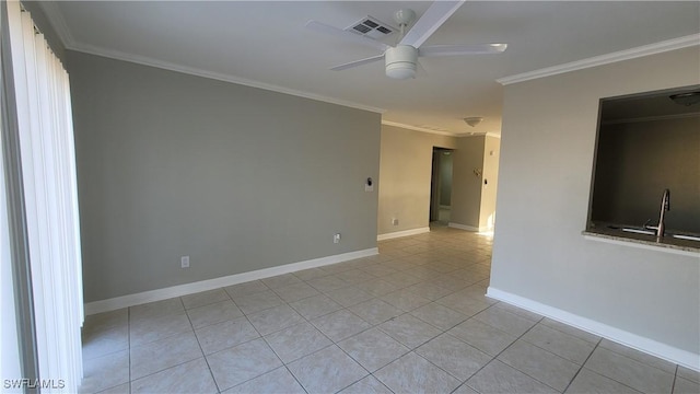 tiled empty room featuring ceiling fan and crown molding