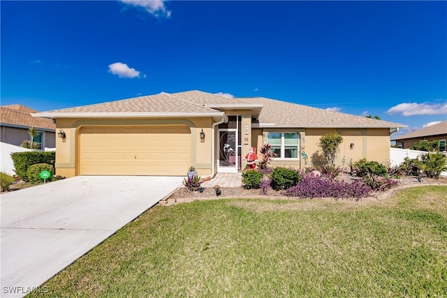 view of front of home featuring a garage and a front yard