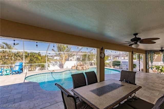 view of pool featuring a patio and ceiling fan