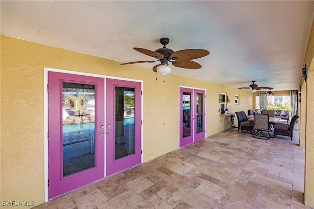 view of patio / terrace with ceiling fan and french doors