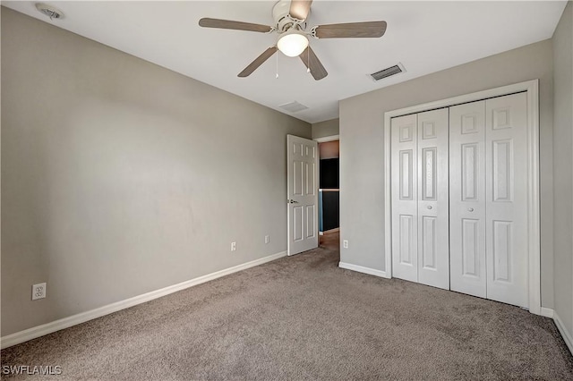 unfurnished bedroom with carpet flooring, a closet, and ceiling fan