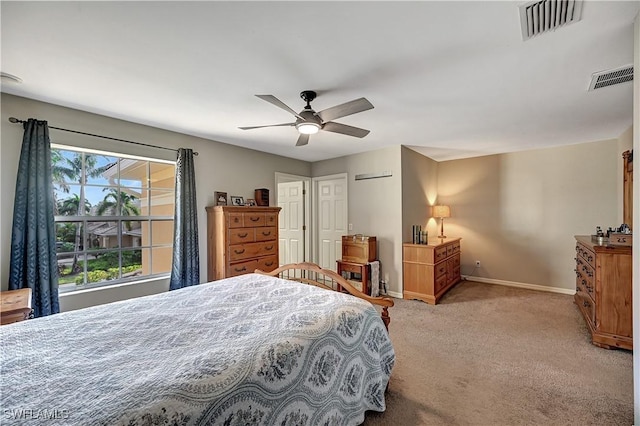 bedroom featuring ceiling fan and light carpet