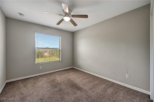 spare room with carpet and ceiling fan