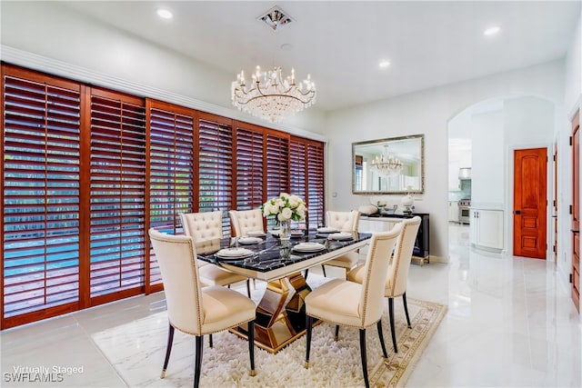 1160 8th St S, Naples, FL 34102 - dining area featuring arched walkways, a chandelier, marble finish floor, and recessed lighting