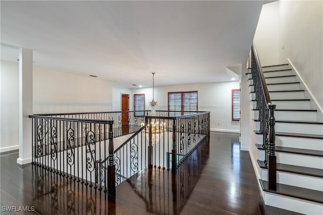1160 8th St S, Naples, FL 34102 - staircase with recessed lighting, a chandelier, baseboards, and wood finished floors